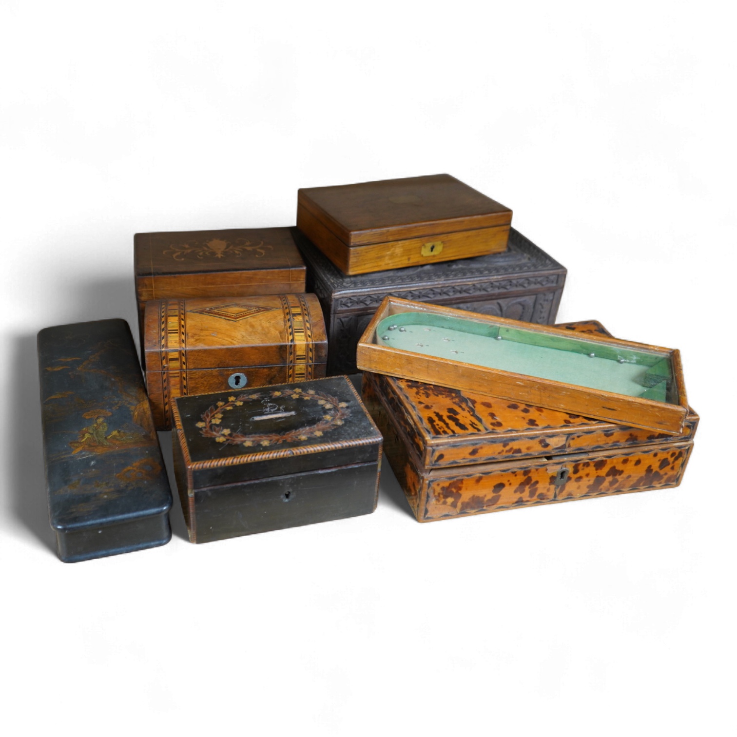 A blonde tortoiseshell veneered box, six other boxes and a miniature bagatelle board